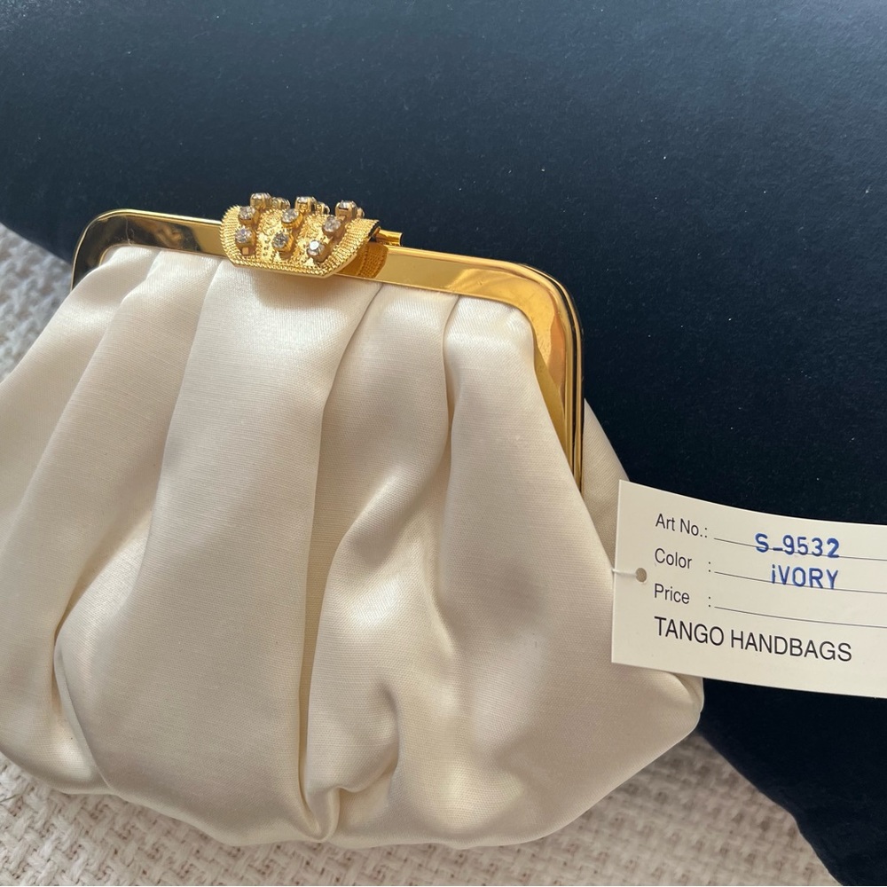 Tango Ivory Evening bag.Brand new.  Gold strap.Rhinestone closure accent